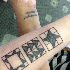 two people with matching tattoos on their arms