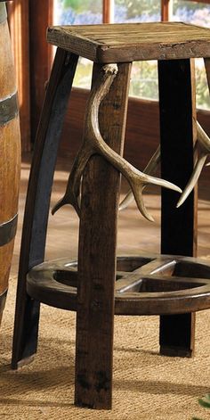 a wooden stool with deer antlers on it