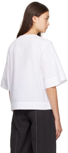 Organic cotton poplin blouse. · Crewneck · Keyhole cutouts at four-button closure · Darts at chest Supplier color: Bright white Poplin Short Sleeve Workwear Blouse, Short Sleeve Poplin Blouse For Work, Short Sleeve Poplin Tops For Work, Chic Daywear Poplin Top, Chic Poplin Top For Daywear, Chic Poplin Tops For Workwear, Modern Poplin Tops For Spring, Casual Poplin Tops For Office, Modern Poplin Blouse For Work