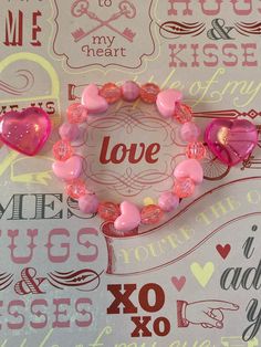 This is a Valentine heart bracelet.  It would make a cute gift for a little girl for Valentines Day. It would make a cute addition to a little girl's Valentines outfit. It has five pink heart pony beads. It has pink and solid pink 8mm faceted beads. It was made with .8mm sturdy stretch string. I tie it several times to prevent breakage. It fits girls ages 5-8. It stretches to fit on the wrist. All items are ready to be shipped I do combined shipping. Items ship in 2-5 business days. Check out mo Gifts Bracelets, Girls Valentines Outfit, Gifts For Valentines, Bracelets For Kids, Bracelets For Girls, Valentines Outfit, Valentines Bracelets, Bracelet Heart, Valentines Outfits