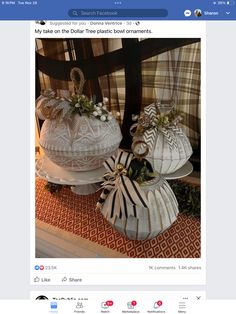 two white baskets sitting on top of a table