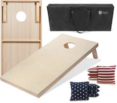 a cornhole game set with an american flag bandanna and two wooden bean bag tossers