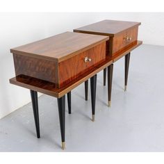 two wooden side tables with metal legs and drawers