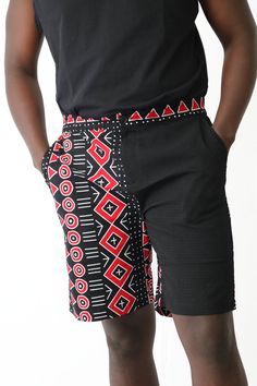 This 2 Faced male African Ankara mixed shorts is uniquely made to fit your waist, it has a button and zipper and no belt is required. It has side seam pockets and 1 back pocket effect. This is a typical male short which falls above the knees. You can wear this tucked in to fit your occasion Fabric:100% Cotton African print wax Model:6'3'' and wears XL Fitted Cotton Shorts With Side Pockets, Cotton Shorts With Hip Pockets And Short Inseam, Fitted Black Cotton Bermuda Shorts, Black Bermuda Shorts With Belt Loops For Summer, Fitted Shorts With Hip Pockets, Cotton Knee-length Shorts With Belt Loops, Black Cotton Bermuda Shorts With Short Inseam, Red Shorts With Side Pockets, Fitted Bermuda Shorts With Pockets In Black