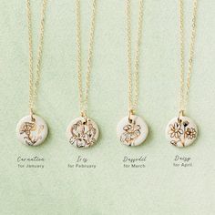 Celebrate life's memorable moments with a handcrafted necklace. Each of these handmade 5/8" pottery pendants features a hand-drawn flower in 22k gold and hangs from an 18-inch 14k gold-filled chain. Every piece is made by Curry Wilkinson Pottery in Burlington. Available in 12 designs (each sold separately): Carnation - January birth flower - 1st wedding anniversary flowerIris - February birth flower - 25th wedding anniversary flowerDaffodil - March birth flower - 10th wedding anniversary flowerD Pottery Pendants, February Birth Flower, Flower Pottery, January Birth Flower, Pottery Necklace, 19th Wedding Anniversary, July Birth Flower, March Birth Flowers, February Birth Flowers