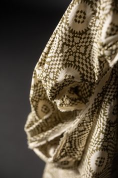 a close up view of a scarf on a mannequin's head with black and white patterns