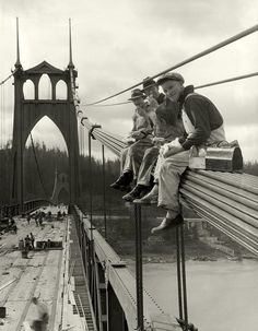 an old photo of two people sitting on a bridge with the caption in english