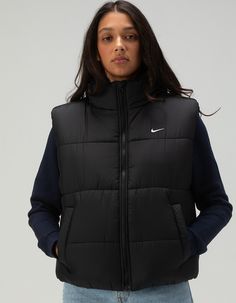 Nike Sportswear Classic Puffer Vest. Take On The Winter Chill In A Vest Designed To Add Some Warmth To Your Life. Loose Enough To Layer, Its Synthetic Fill Adds Insulation While Nike Therma-Fit Technology Helps Manage Your Body's Natural Heat To Help Keep You Warm In Cold-Weather Conditions. On Top Of That, A Water-Repellent Finish Helps Keep You Dry. So Zip It Up, Throw Your Hands In The Pockets And Get Out There! Nike Therma-Fit Technology Helps Manage Your Body's Natural Heat To Help Keep You Warm In Cold-Weather Conditions. Water-Repellent Finish Helps Keep You Dry In Wet Weather. Snap Pockets Let You Keep Your Small Items Close—or Keep Your Hands Out Of The Cold. Embroidered Swoosh Logo. 100% Polyester. Machine Wash. Imported. Model Is Wearing A Size Small. Model Measurements:height: Functional Winter Streetwear Activewear, Winter Workout Sportswear Outerwear, Sleeveless Activewear For Fall Workout, Sleeveless Fall Activewear For Workouts, Fall Sleeveless Workout Activewear, Nike Casual Activewear For Outdoor Activities, Nike Moisture-wicking Outerwear For Workout, Casual Nike Activewear For Outdoor Activities, Casual Nike Outerwear For Workout