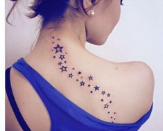 the back of a woman's shoulder with stars on it