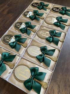 the table is decorated with gold and green ribbon, monogrammed plates and bow ties