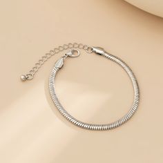 Silver-plated snake chain bracelet with adjustable length. 6.3" L with 2" extender Lobster claw clasp Silver-plated copper Snake Chain Bracelets, Snake Chain, Chain Bracelet, Silver Plate, Silver Bracelet, Gold Bracelet, Copper, Plating, Chain