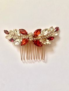 Elegant ruby red crystal on gold hair comb. Comb also available in emerald green and clear crystal colour.  All bridal accessories are made from the very highest standard using the finest quality materials.  *Shipped with Royal Mail 1st class.  *Ready to ship in one business day. So Red Hair Pieces, Red Hair Clips, Hair Clip Wedding, Bright Red Hair, Crystal Hair Comb, Hair Jewellery, Wedding Hair Clips, Bridal Hair Comb