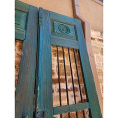 an old wooden door with iron bars on it