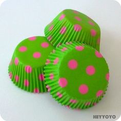 three green and pink polka dot cupcake cases