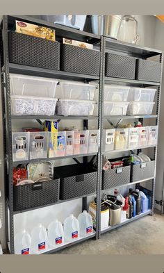 the shelves are organized with plastic containers and other items