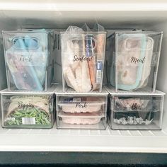 the refrigerator is stocked with plastic containers containing food and other items, including meats