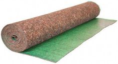 a roll of carpet on top of a green mat