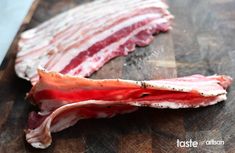 bacon on a cutting board with a knife