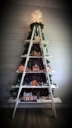 a christmas tree made out of wooden shelves