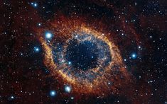 the eye of god in the sky is surrounded by stars and bright blue dusts