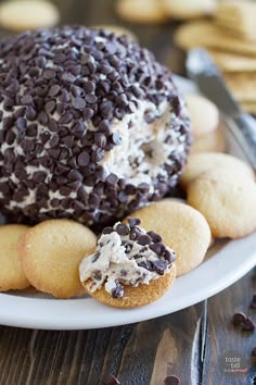 chocolate chip cookies and cream cheesecakes on a white plate with oreo crackers