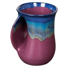 a purple and blue ceramic pitcher on a white background