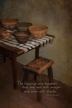 a table with two bowls on it and a quote from thomas corning about thanksgiving