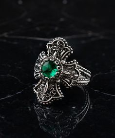 Emerald Silver Gothic Medieval Cross Ring, 925 Sterling Silver Green Quartz Handmade Filigree Unisex Celtic Cross Ring, Christian Gift Ring christian mom gift, punk green ring, Religious Jewelry, anniversary gift her, birthday gift her Material: 925 Sterling Silver ( NICKEL FREE ) Gemstone: Emerald Quartz 6mm. The Emerald Silver Gothic Medieval Cross Ring you mentioned is another handmade piece crafted from 925 sterling silver. Similar to the previous description, this ring features intricate filigree work in a gothic medieval style, with a Celtic cross design. However, instead of a ruby stone, this ring incorporates a green quartz stone, specifically an emerald. The green quartz stone, often referred to as emerald quartz, brings a vibrant green hue to the ring. Green is a color associated Gothic Emerald Ring, Gothic Silver Rings With Intricate Design, Christian Mom Gifts, Medieval Cross, Emerald Quartz, Gothic Medieval, Green Ring, Medieval Fashion, Cross Ring