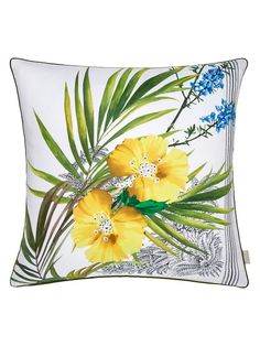 yellow flowers and green leaves on a white pillow with blue trimmings in the center