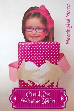 a girl with glasses is holding a valentine's box and smiling at the camera