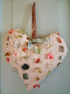 a heart shaped decoration hanging on the wall