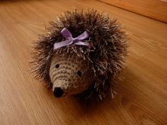 a stuffed hedgehog with a bow on its head