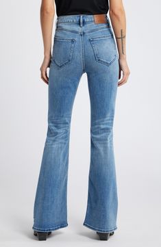 Distressed details add vintage vibes to these high-rise, full-length flare jeans made from faded, whiskered stretch denim. 33" inseam; 11 1/2" front rise Zip fly with button closure Five-pocket style 93% cotton, 5% polyester, 2% spandex Machine wash, tumble dry Imported Fitted Wide Leg Flares With Frayed Hem, Distressed High Rise Fitted Flares, Distressed High-rise Fitted Flares, Fitted High Rise Distressed Flares, Mid-rise Medium Wash Flares For Fall, Fitted Distressed Light Wash Flare Jeans, Fitted Distressed Denim Flares, Distressed Fitted Flares, Fitted Flare Jeans With Frayed Hem