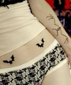 a woman's stomach with bats on it and the bottom part of her panties