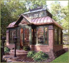 a small brick house with a glass roof