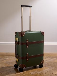 Globe-Trotter's carry-on suitcase is part of its 'Centenary' collection, which celebrates 100 years of the brand. It's made from vulcanised fibreboard with durable leather trims and push-lock fastenings to keep your essentials secure. Sized to store everything you need for a weekend away, it has smooth wheels and a telescopic handle that make it easy to navigate through busy terminals. Furniture Upcycling, District Vision, Bag Suitcase, Carry On Suitcase, Cycling Accessories, Suede Jacket, Luxury Gifts, Globe Trotter, Mr Porter