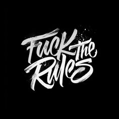 the words trucking rules written in white ink on a black background with spray paint