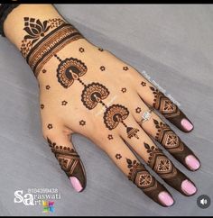 a henna tattoo on the palm of a woman's hand