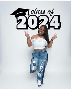 a woman in jeans and a white top is holding her hands up with the words class of 2012 above her head