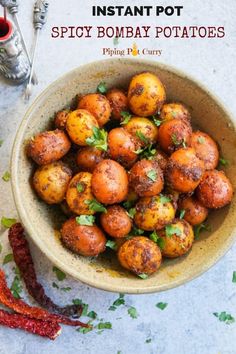 a bowl filled with potatoes on top of a table