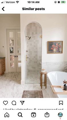 a large bathroom with a walk in shower next to a bathtub