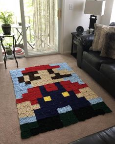 the rug is made to look like an old video game character, and has been placed on the floor