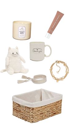 the contents of a baby's gift set including a teddy bear, candle and other items