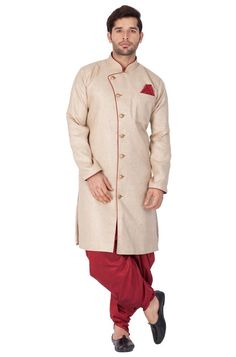 Vastramay brings to you this Stylish yet Comfortable Men Biscuit Men Beige Jute Feel Indowestern Angrakha Style Sherwani With Cowl Style Patiala Dhoti Pant Set. Adorn it for a perfect Classy and Trendy look. Pair it with a juti or a mojari for the Royal look. Product Features :   Top Color: Beige Bottom Color: Maroon Top Fabric: Cotton Blend Bottom Fabric: Cotton Blend Lining Material: Cotton Satin Product Type: Indowestern Angrakha Sherwani with Patiala Dhoti Pant Set Product Length: Knee Lengt Navratri Designer Sherwani With Naqshi Detailing, Navratri Designer Sherwani With Naqshi, Designer Naqshi Sherwani For Navratri, Traditional Naqshi Kurta For Groom, Navratri Sherwani With Naqshi And Straight Kurta, Beige Sherwani For Eid, Wedding Sherwani With Naqshi For Navratri, Naqshi Sherwani For Wedding And Navratri, Naqshi Sherwani For Wedding During Navratri