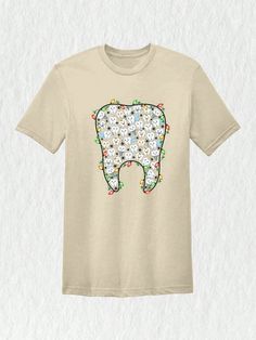 a t - shirt with a tooth decorated with flowers