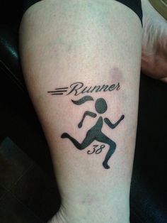 a person with a tattoo on their leg that says runner's 3 8 and has a running man