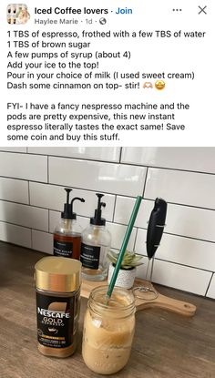 a jar of liquid sitting on top of a counter next to a bottle of coffee