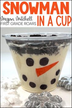 a snowman cup with chocolate chips and marshmallows on the side, in front of it