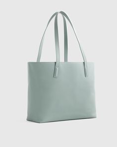 This well designed, full-size, beautiful Italian leather tote bag is perfect for your everyday needs. Includes all the inner organization to keep you on track throughout the day including a 13" laptop slip, iPhone pocket, zipper pocket, plus several other pockets and a hook for your keys. Your go-to everyday tote, no doubt.  | Quince | Women's Classic Italian Leather Tote Bag in Dusk Blue Blue Leather Laptop Bag For Everyday Use, Everyday Blue Leather Laptop Bag, Modern Soft Leather Tote Laptop Bag, Minimalist Laptop Tote Bag For Office, Minimalist Office Laptop Tote Bag, Everyday Double Handle Satchel With Laptop Sleeve, Modern Everyday Bag With Laptop Sleeve, Blue Leather Laptop Bag For Daily Use, Minimalist Travel Bags With Interior Card Slots