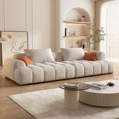 a living room with a couch, coffee table and bookshelf on the wall